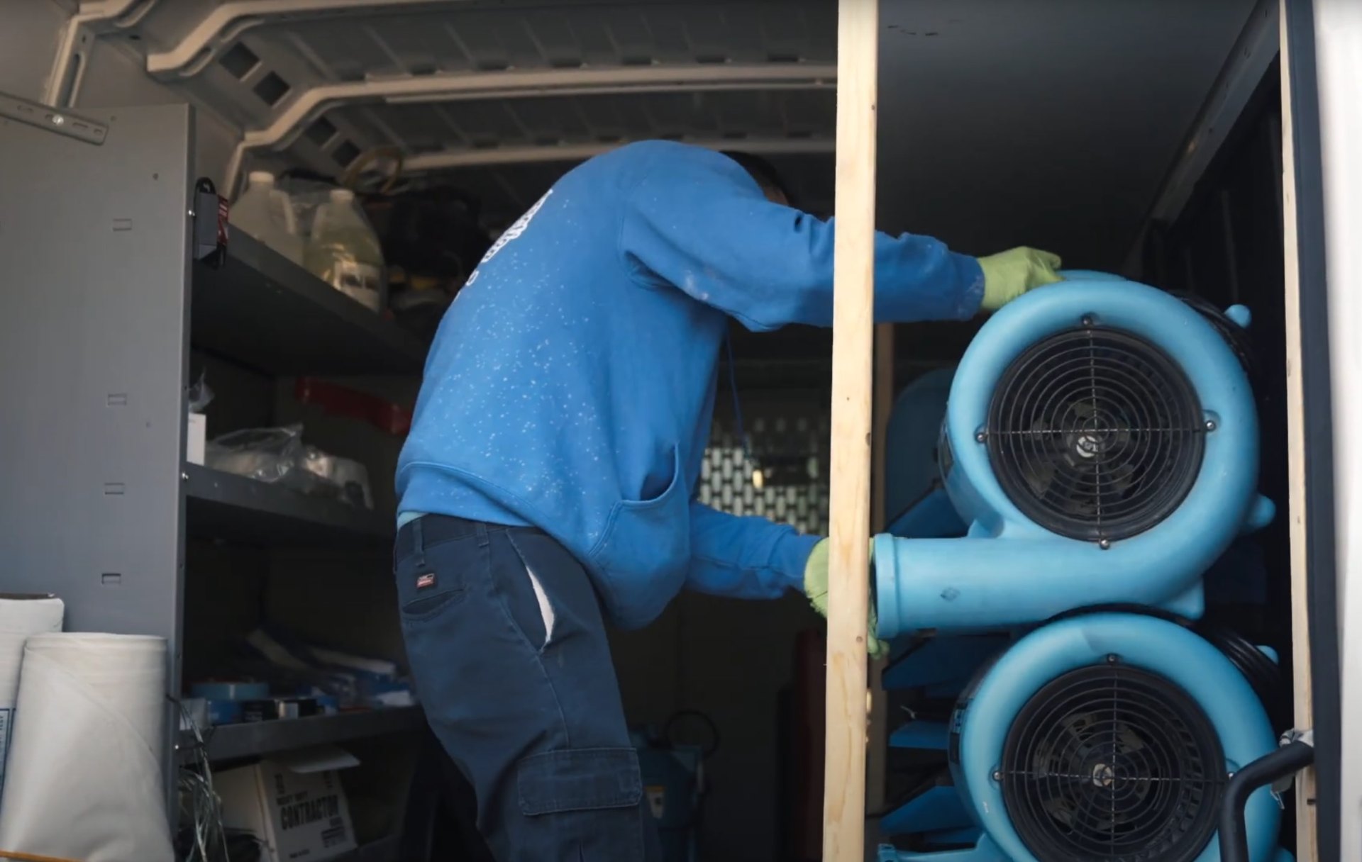 Industrial water damage restoration equipment and professional drying systems Professional water damage restoration work showing industrial drying equipment and air circulation systems
