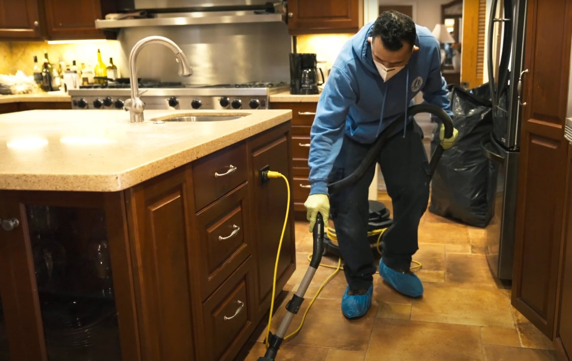 Water damage restoration equipment and professional cleaning services Professional technician using specialized equipment for floor cleaning and water damage restoration